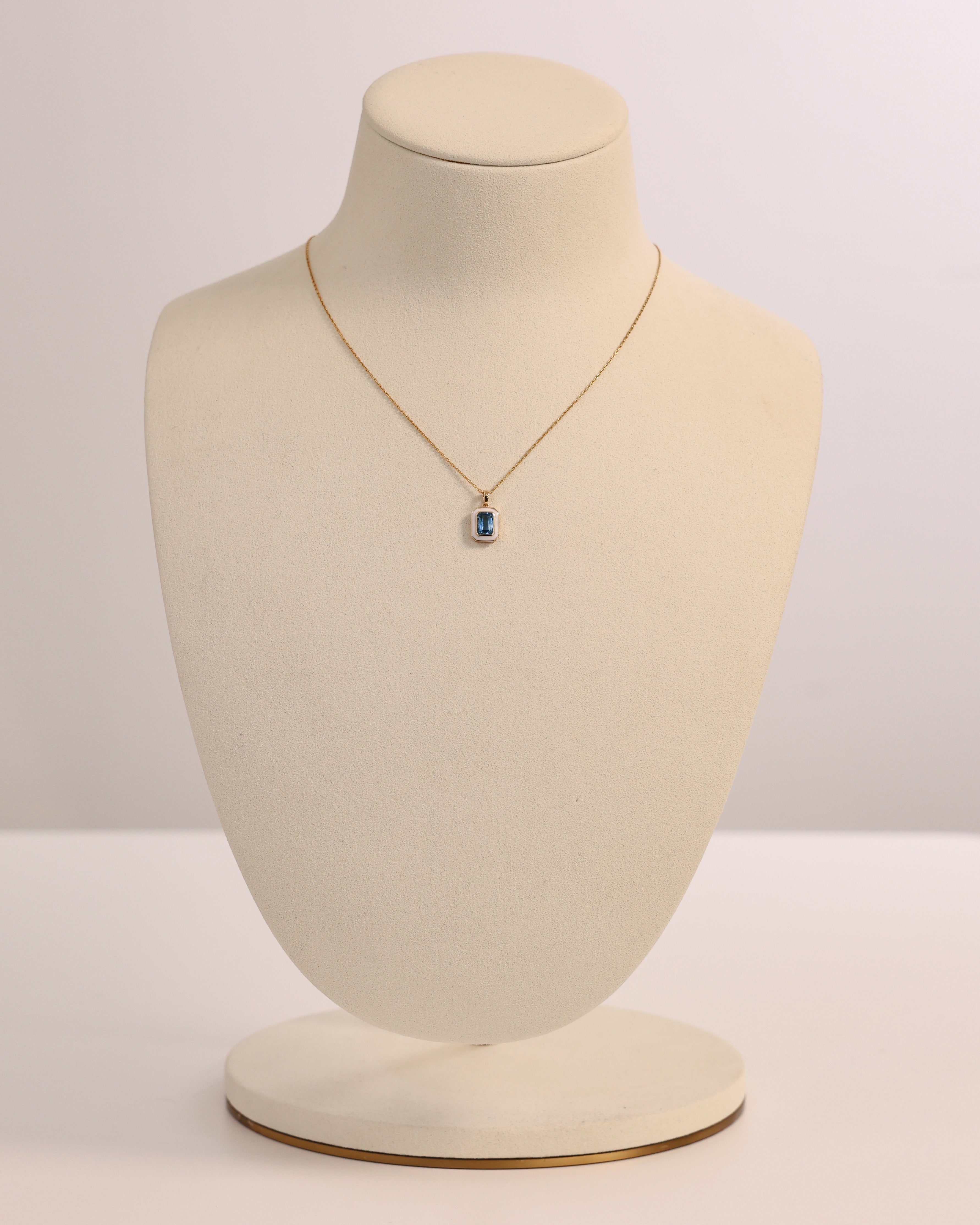 BLUE TOPAZ & WHITE ENAMEL PENDANT