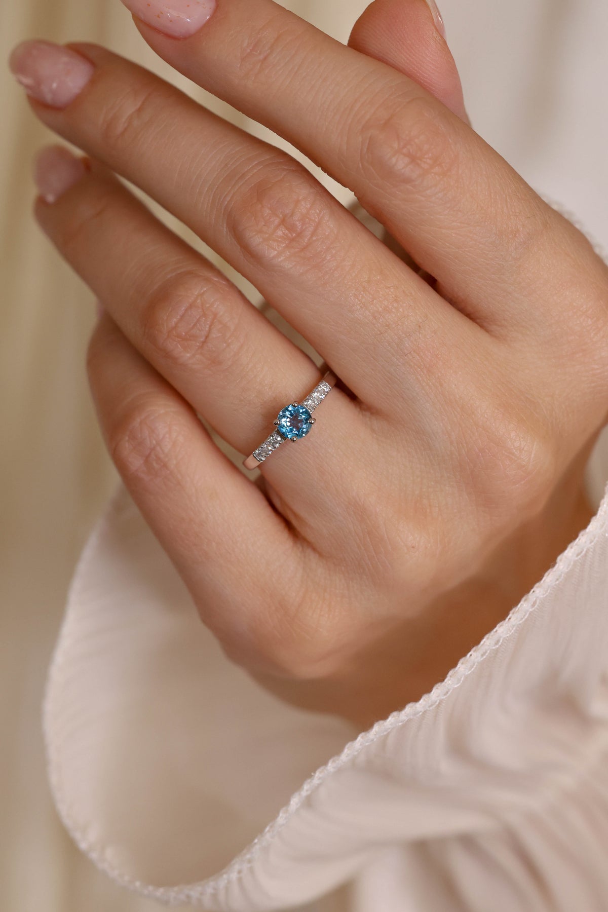 Round Blue Topaz and Diamond Solitaire Ring in 18K White Gold – view 2
