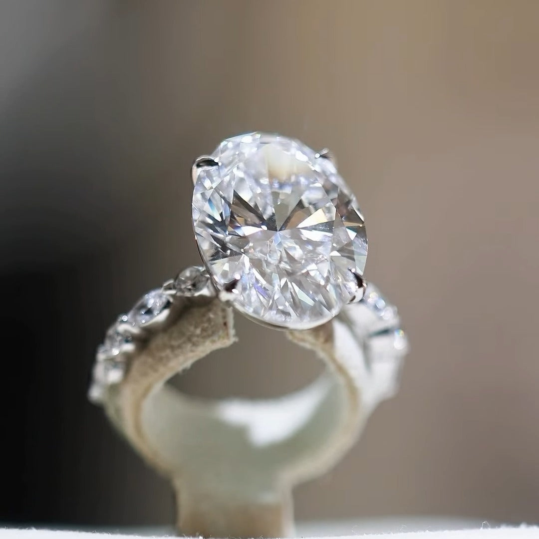 Custom oval diamond engagement ring with side stones by BYORO Dubai