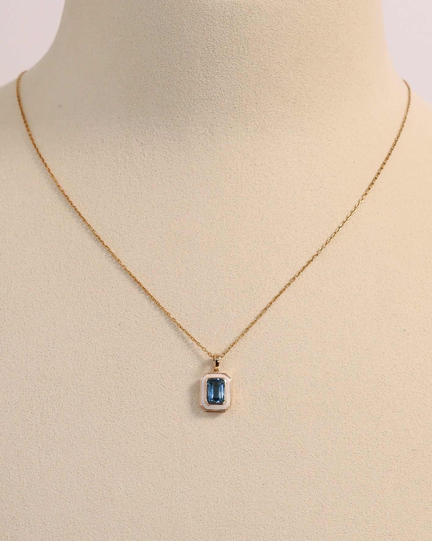 BLUE TOPAZ & WHITE ENAMEL PENDANT