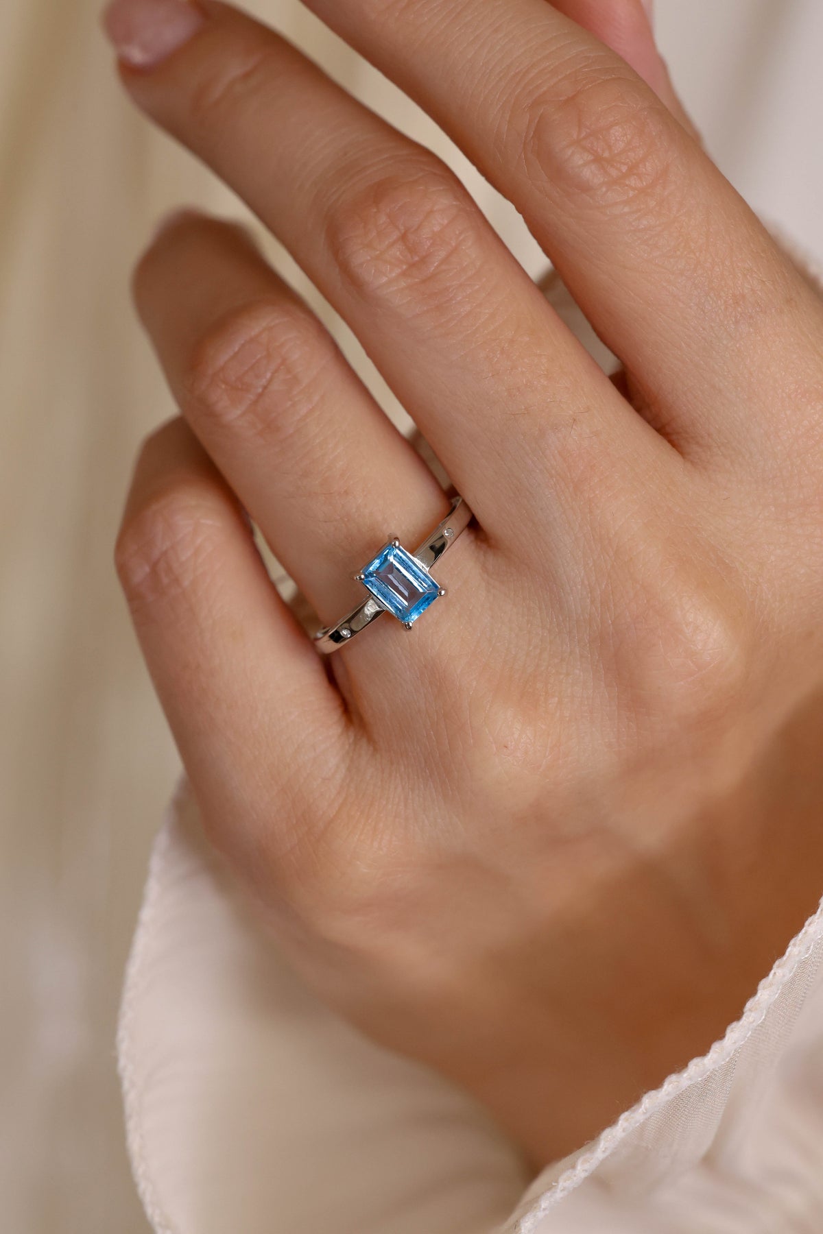 Emerald-Cut Blue Topaz Solitaire Ring in 18K White Gold – view 2